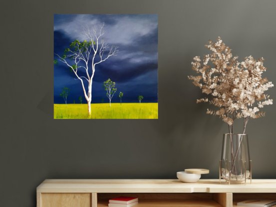 Australian landscape in blues and lime with a stormy sky and a gum tree in the foreground