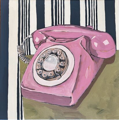 Pink vintage telephone with dial and navy stripe wallpaper