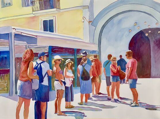 Tourists standing in a queue.  