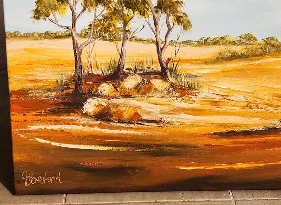 This painting captures the raw beauty of the Outback—the play of light on red earth, the sparse vegetation, and the sense of solitude. I love the vastness of the Outback, the sweeping, remote, arid land where many make a home and a living.

As you gaze at this painting, imagine the heat shimmering above the red soil, the scent of eucalyptus leaves, and the distant call of a bird. The Outback isn’t just a place; it’s an experience—an immersion in the elemental forces of nature.

Remember, art allows us to see the world through different eyes. Whether you’ve stood on the red earth yourself or dreamt of doing so, this painting invites you to connect with the essence of the Australian Outback. 🌅🎨