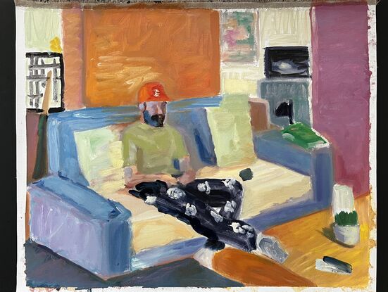 Man sitting on a lounge in a colourful living room