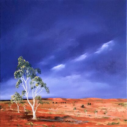 Australian landscape in yellows, oranges and deep blue sky with a road and gum trees, dust storm coming