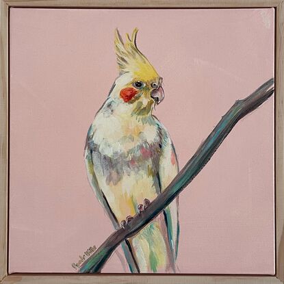 Yellow cockatiel portrait seated on a thin branch, with a retro peach background. Framed and ready to hang.