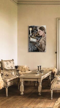 Beautiful woman reading vintage book under candle light with lace, flowers, gramophone and vintage clock