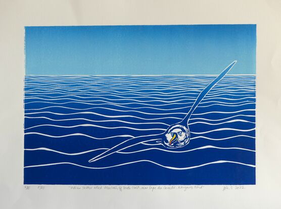 The linoprint is a graphic graduated tonal representation of an Albatross soaring across the Southern Ocean.