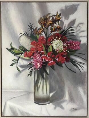 Bunch of flowers in glass vase with Red Gum Flowers, Grevilleas, banksia and kangaroo paws