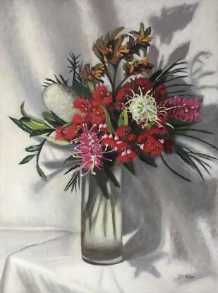 Bunch of flowers in glass vase with Red Gum Flowers, Grevilleas, banksia and kangaroo paws