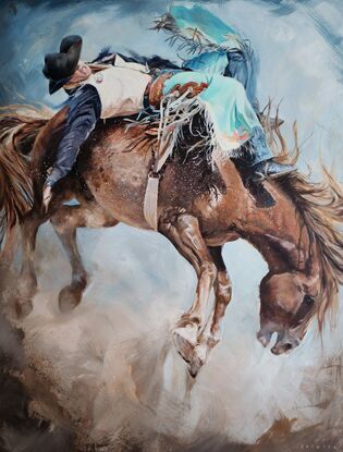 Close up of a cowboy in turquoise chaps riding a wild bucking horse in rodeo. Dust and fast action