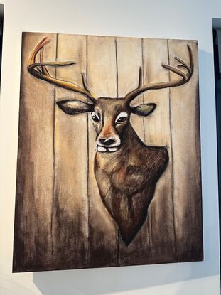 A deer bust hanging on a cabin wall