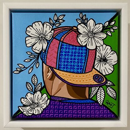 Acrylic painting  of a  colourful flat brim cap design with black and white flowers and using paint markers creating intricate patterns and bold black outlines on a blue and green background