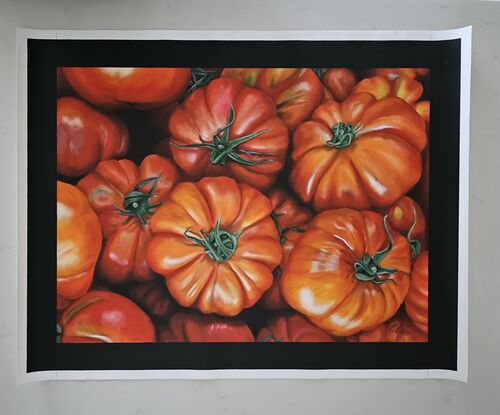 A close up of heritage tomatoes at a market stall. 