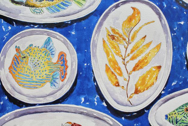 A colorful original watercolor of a collection of handmade ceramic plates with sea life painted on them including a leafy sea dragon, a crab, an octopus, a sea slug and an assortment  of reef fish all on a bright blue background.