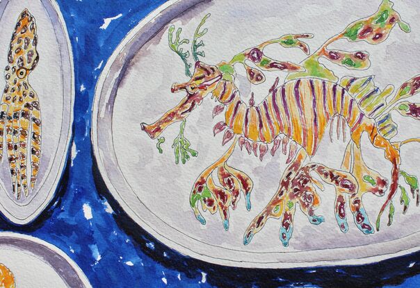 A colorful original watercolor of a collection of handmade ceramic plates with sea life painted on them including a leafy sea dragon, a crab, an octopus, a sea slug and an assortment  of reef fish all on a bright blue background.