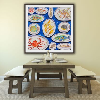 A colorful original watercolor of a collection of handmade ceramic plates with sea life painted on them including a leafy sea dragon, a crab, an octopus, a sea slug and an assortment  of reef fish all on a bright blue background.