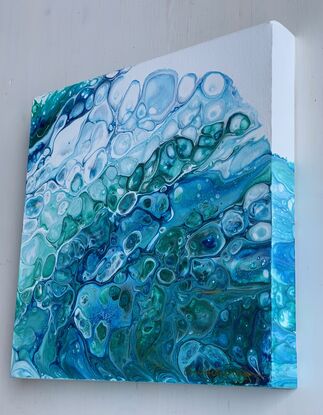 Fresh ocean wave flowing with bubbles