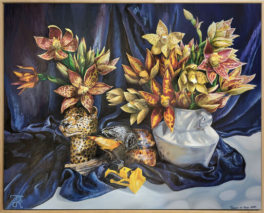 A leopard vase and a larger plain vase hold bunches of golden toned sun orchids while a little spotted pardalote sits on a log between the vases peering down at a little digger figurine. 