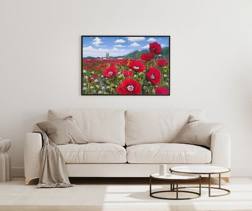 A breathtaking painting showcases a vast field blanketed with radiant red poppies, their petals vibrant and full of life. The poppies sway gently, creating a sea of red that seems to go on endlessly. Above, the sky is a brilliant shade of blue, providing a stark and beautiful contrast to the red below. The atmosphere is serene and peaceful, with the beauty of nature taking centre stage. The simplicity of the scene, devoid of any symbols or distractions, allows the viewer to immerse themselves fully in the tranquil beauty of the poppy field.