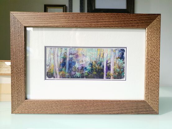 Framed miniature oil painting in purple and blues with mustard, of a sunlit sapling forest with dense understory scrub. By Victoria Collins. Frame is solid wood, dark toned. 