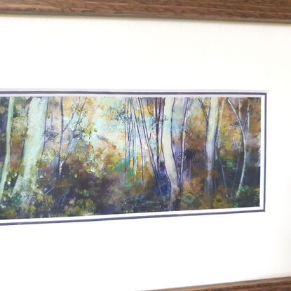 Framed miniature oil painting in purple and olive greens with mustard, of a sunlit sapling forest with dense understory scrub. By Victoria Collins. Frame is solid wood, dark toned. 