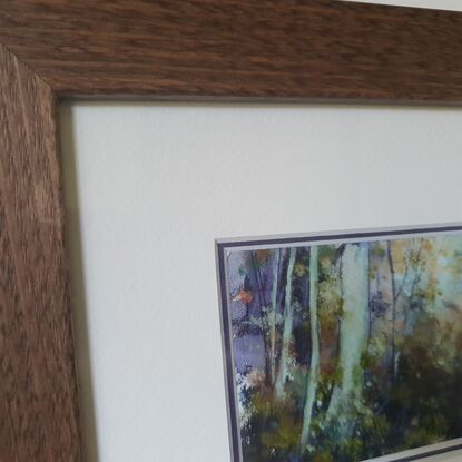 Framed miniature oil painting in purple and olive greens with mustard, of a sunlit sapling forest with dense understory scrub. By Victoria Collins. Frame is solid wood, dark toned. 