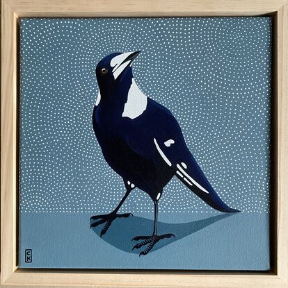 Black and blue toned magpie on pale blue background with white dot patterned background. 