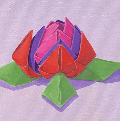 Origami flower in pink, red, purple and green