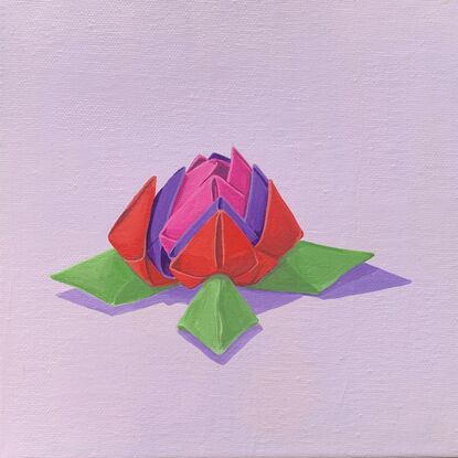 Origami flower in pink, red, purple and green