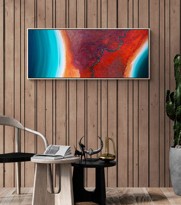 Framed modern abstract seascape print in colourful tones of red, orange and teal.