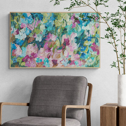 modern colourful abstract canvas print of an expressive floral style of landscape with pink and blue flowers in bloom