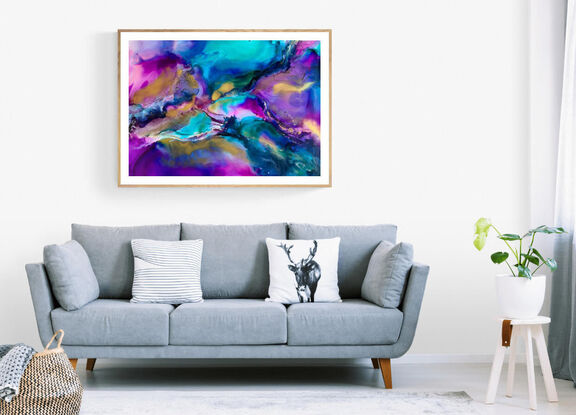 a bold colourful artwork, blues, purples, greens, pinks flow together with pops of bright metallic gold that shimmers in the sunlight