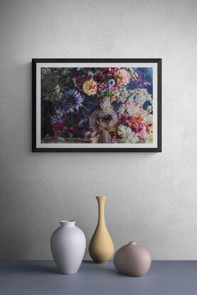 Floral bouquet with vintage glass vase.