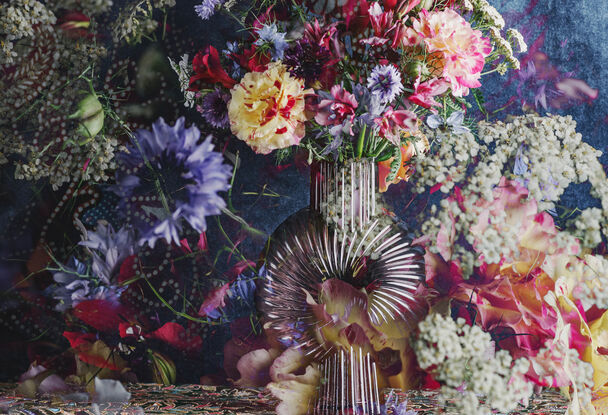 Floral bouquet with vintage glass vase.