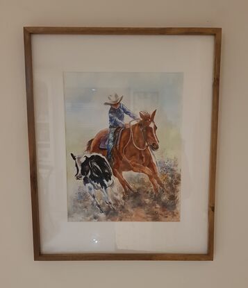 A young rodeo rider in outback Australia in  a campdraft competition. 