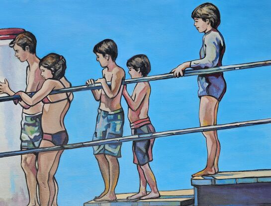 Young children lining up on Wagstaff wharf, ready to dive into the ocean.