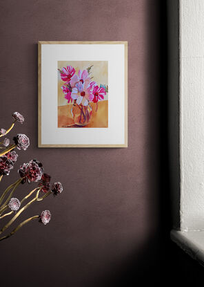 Flowers in a glass water jug.
