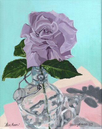 Single long stem purple rose in a glass water bottle, casting a shadow on a pink and teal background.