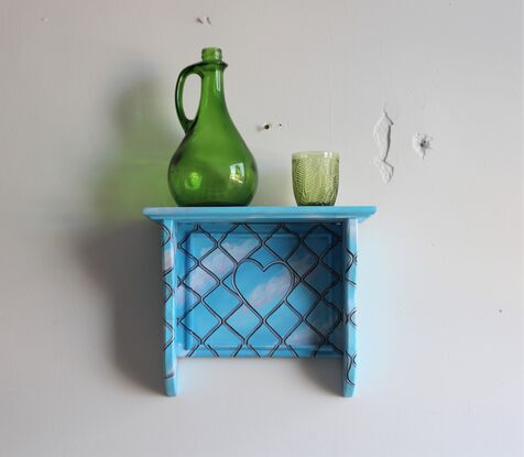 An old wooden shelf painted with a clear blue sky and security door mesh overlayed.