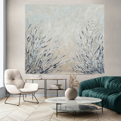 An abstract of wild grass and leaves in light grey, beige and white with silver leaf.  