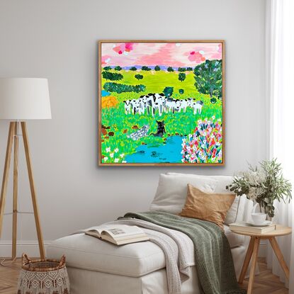 Herd of cows staring at 2 dogs with a beautiful farm landscape behind them