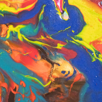 This is a mixture of multiple liquid mediums that have been mixed together to create a dancing array of colour. 