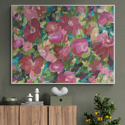 Canvas art print of a large modern red, pink and orange abstract rose flower scene in a garden landscape.