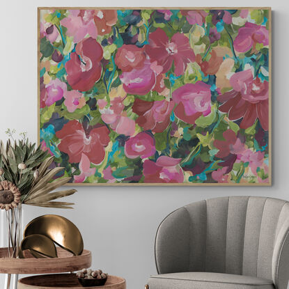 Canvas art print of a large modern red, pink and orange abstract rose flower scene in a garden landscape.