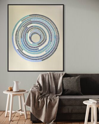 Circular shape made up of various strokes  of colours (blues) going inward on a cream background. Abstract eye. 116cm X 97cm wide 