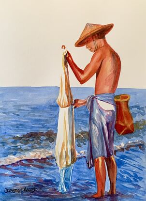 A man checks his fishing net.