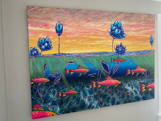 View of a dawning sky and colorful fish underwater