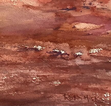 Red ochre earth, shrubs and blue sky with clouds