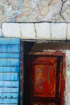 a lost dog stands in front of an old building with blue doors in France