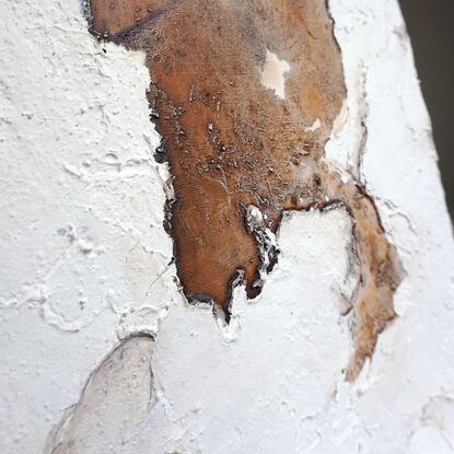 Girl peering through portal in stucco texture