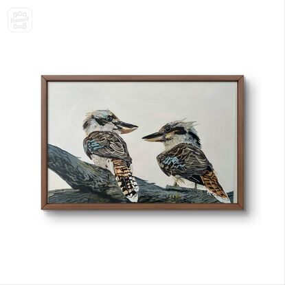 Two kookaburras perched gracefully on a sturdy tree branch, their vibrant feathers standing out against the muted backdrop of the grey sky. Their beauty adds a touch of vibrancy to the scene, capturing the eye with their vivid colors and lively presence.