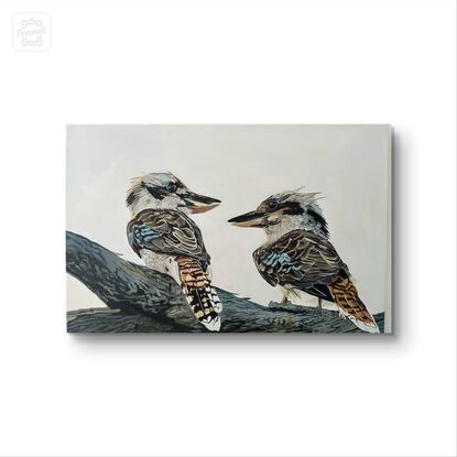 Two kookaburras perched gracefully on a sturdy tree branch, their vibrant feathers standing out against the muted backdrop of the grey sky. Their beauty adds a touch of vibrancy to the scene, capturing the eye with their vivid colors and lively presence.